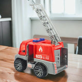 Toy fire truck with an extended ladder on a wooden surface