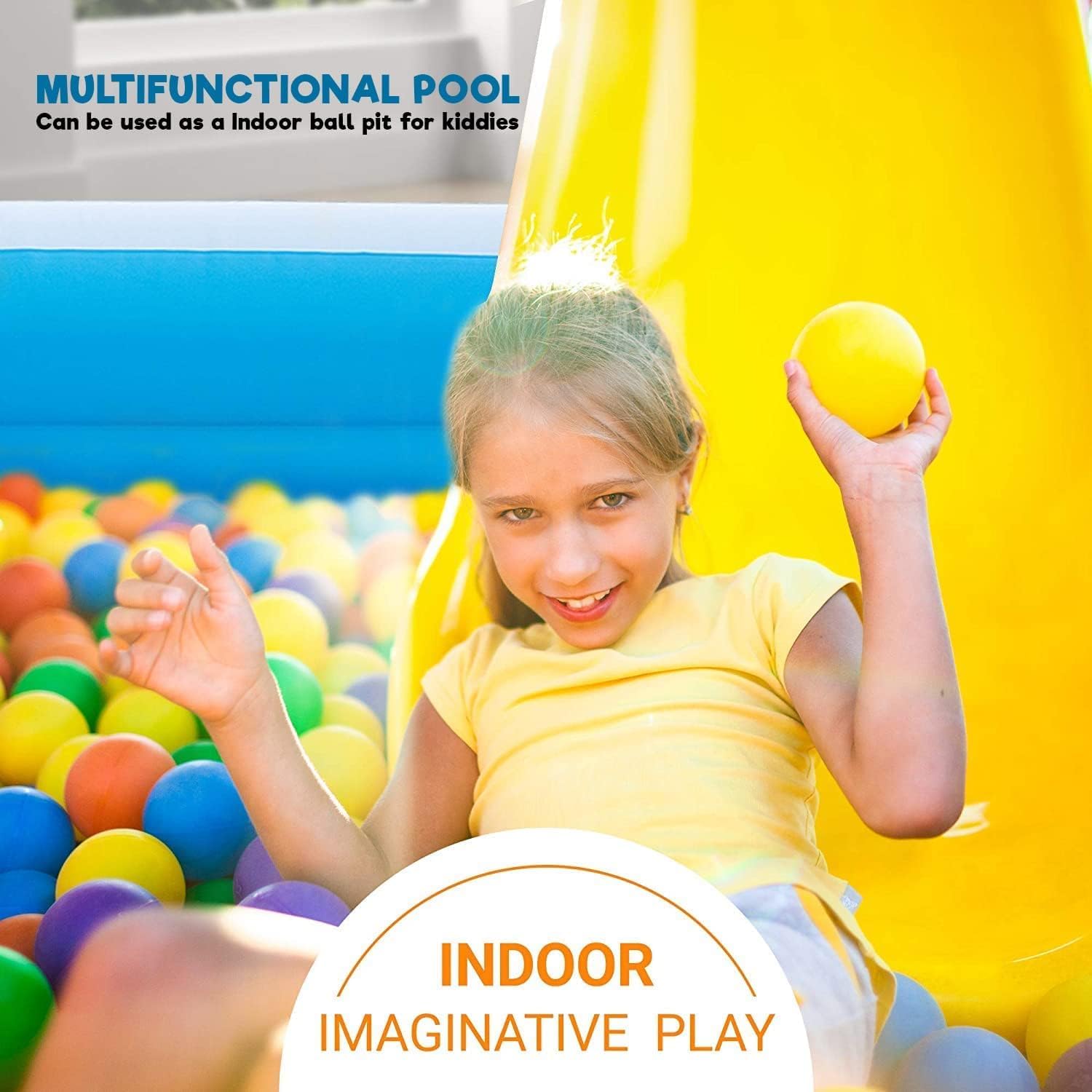Child playing with colorful balls in a multifunctional pool designed for indoor imaginative play.
