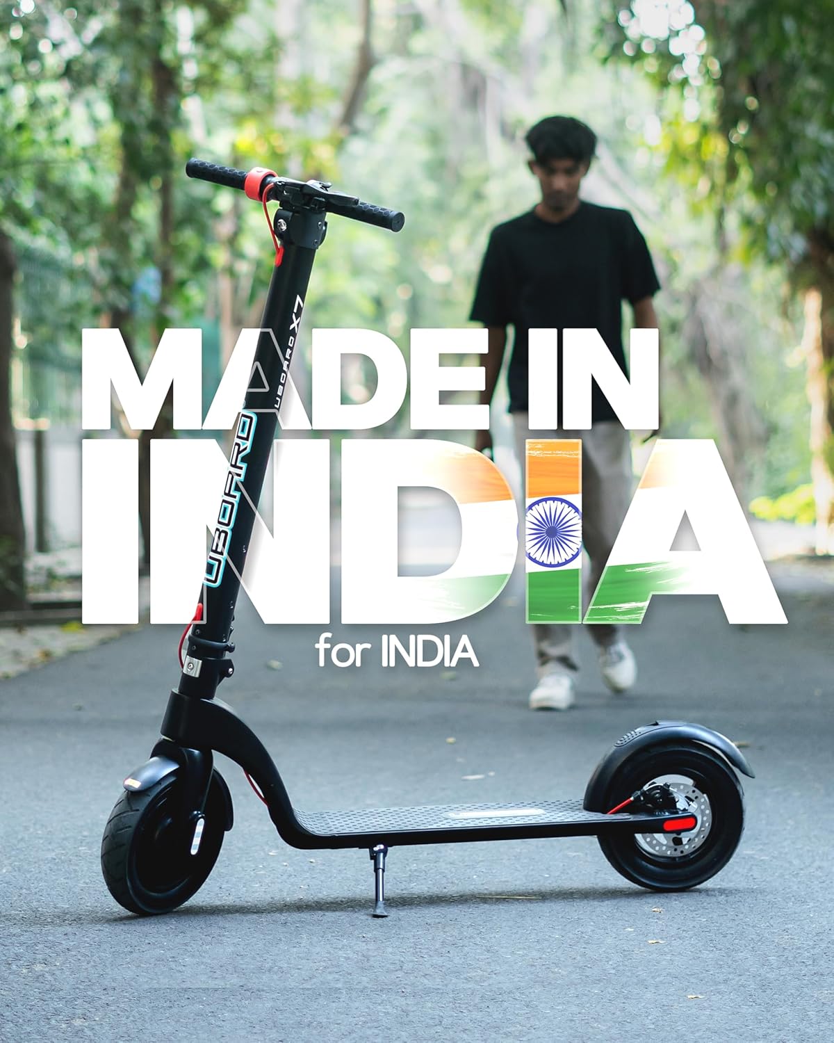 Electric scooter with 'Made in India for India' text and Indian flag colors on a road.