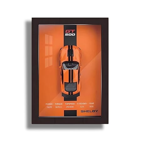 Shelby GT500 model car in a display case with orange background