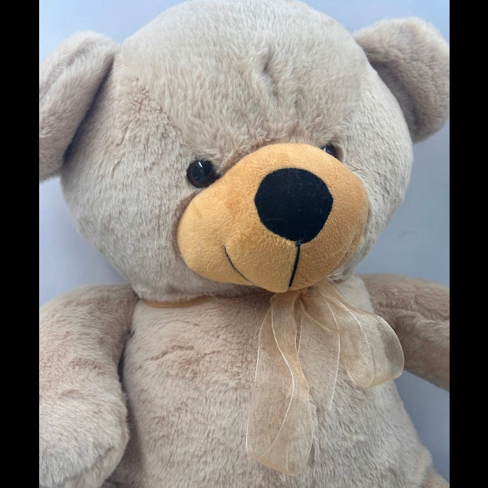 Soft plush teddy bear in cream beige color with ribbon bow – cuddly toy for kids