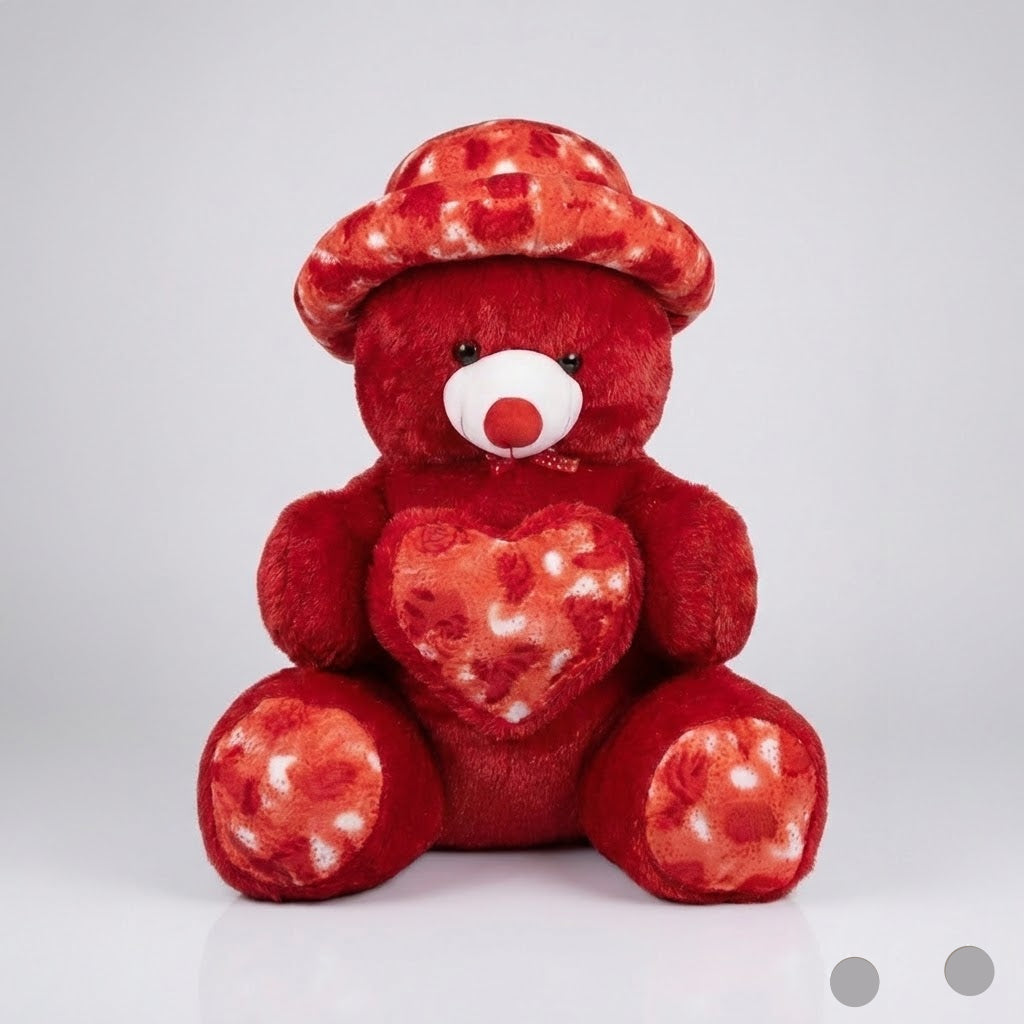 Red teddy bear with a heart design on a white background