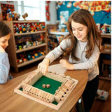 Two children playing with a wooden board game
