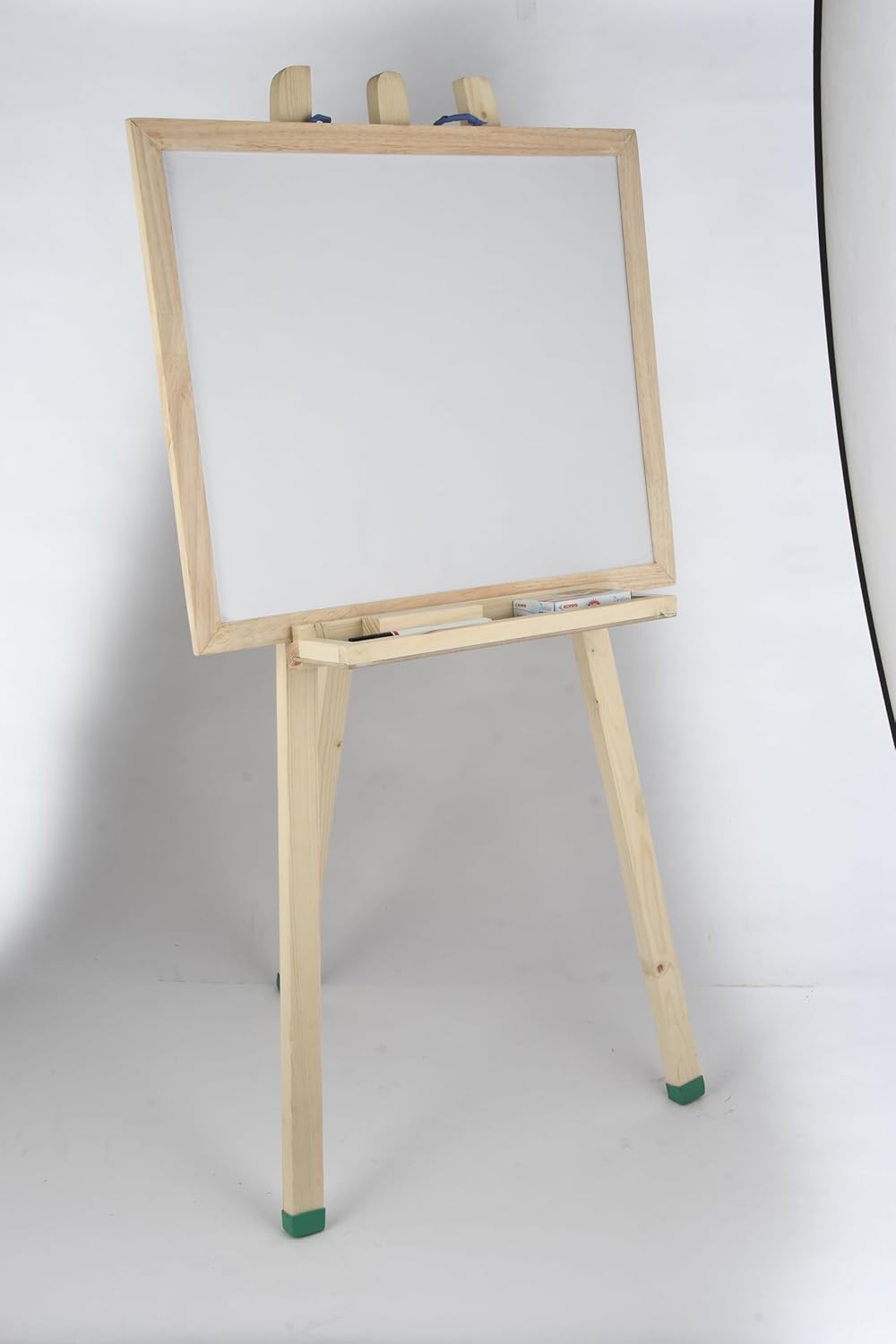 Wooden easel with a white board on a white background