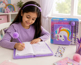 Young girl in a purple shirt sitting at a table with a unicorn-themed writing set.