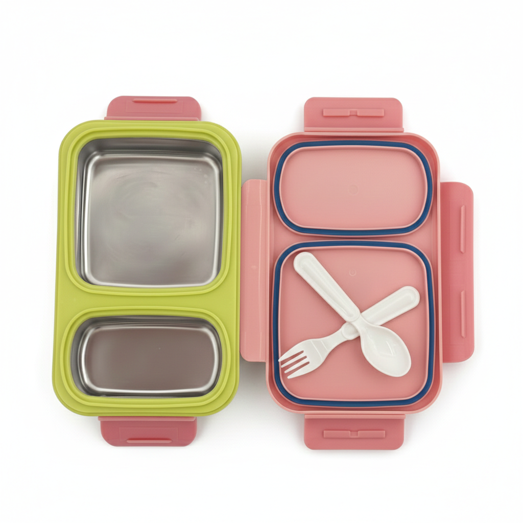 Two bento boxes, one green and one pink, with compartments for food and utensils on a white background.