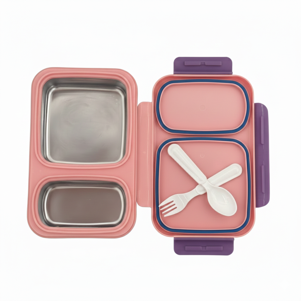 Pink and purple bento box with compartments and a fork and spoon inside on a white background