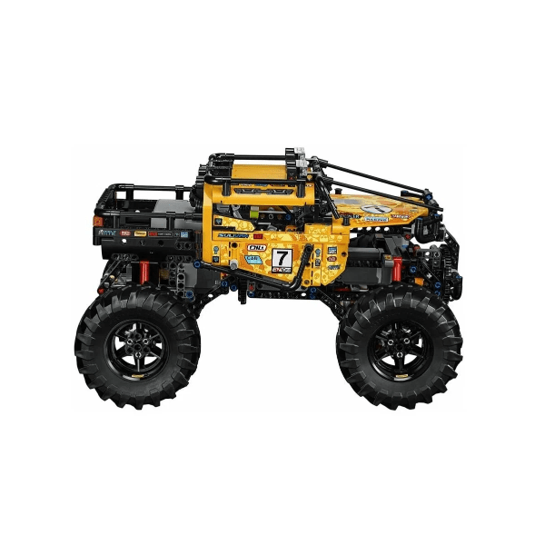 Toy monster truck made of interlocking bricks on a white background