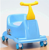 A light blue plastic toddler potty training seat with a yellow handle and four wheels, featuring a small cartoon graphic on the side.