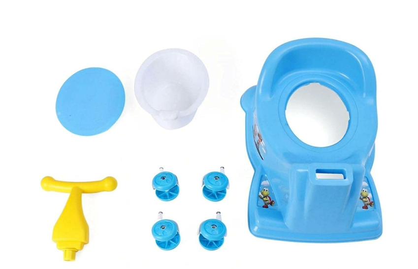 A children's toy toilet training set on a white background, including a blue plastic toilet seat with cartoon graphics, a yellow T-handle pump, a white bowl, a blue circular cover, and four blue plastic nozzles.