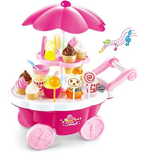 A pink plastic toy ice cream cart with a matching umbrella, decorated with toy cupcakes, lollipops, cones, and a small cartoon bear face. Musical notes are shown floating to the right.