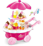 A pink plastic toy ice cream cart with a matching umbrella, decorated with toy cupcakes, lollipops, cones, and a small cartoon bear face. Musical notes are shown floating to the right.